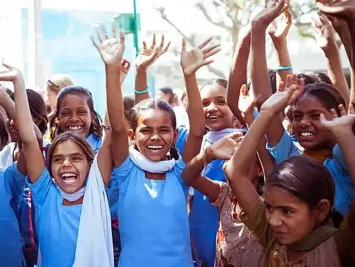 a group of childs raising their hands